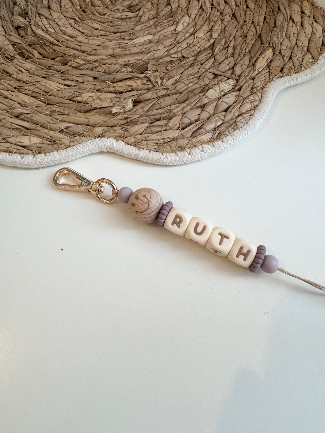 Smiley sleutelhanger paars