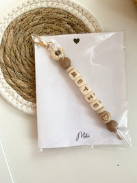 Beige daisy met hartjes kraal en kaartje