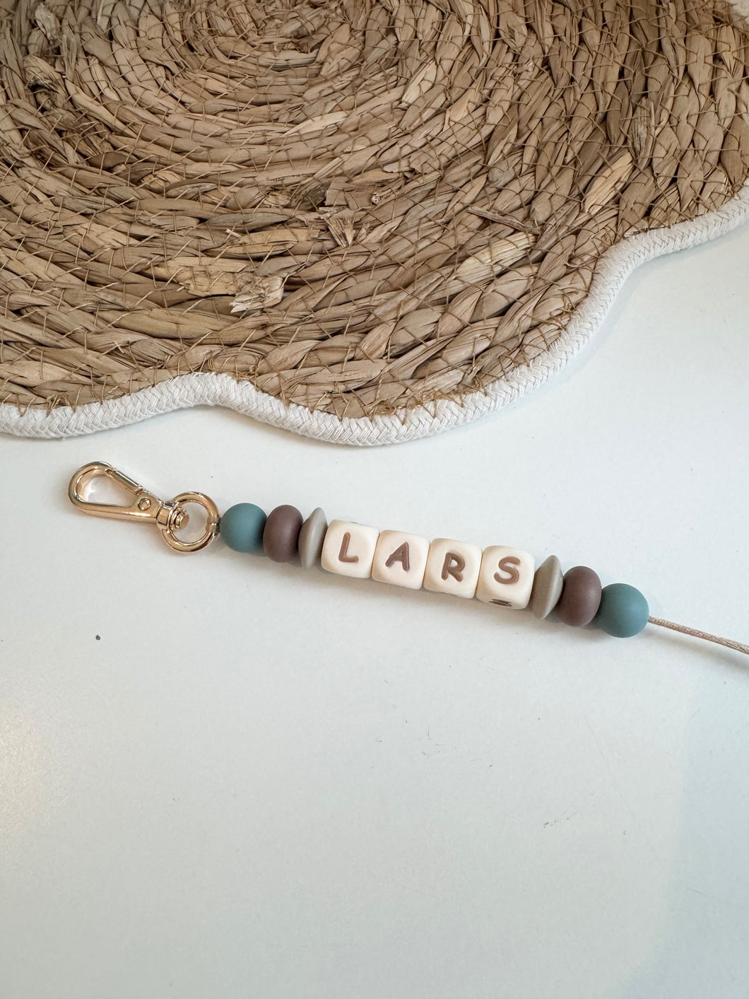 Sleutelhanger blauw/bruin tinten
